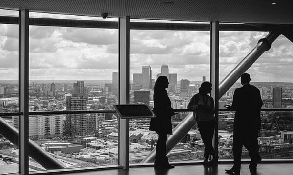 silhouettes of people in front of skyline