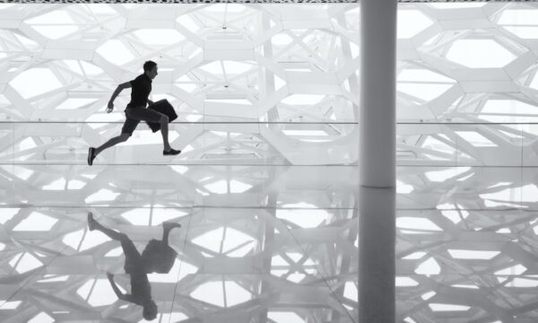 man running through terminal with bag