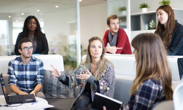 workers discussing in conference room