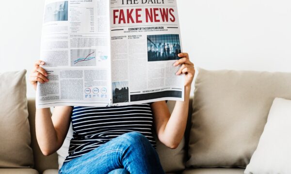 woman reading newspaper