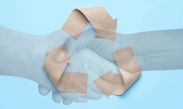 Sky blue background with recycling logo laid out in brown paper, with a transparent image of two hands shaking overlaid (one white, one Black)